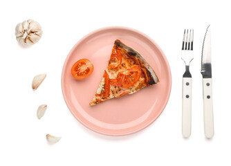 Plate with piece of tasty pizza, garlic and cutlery on white background