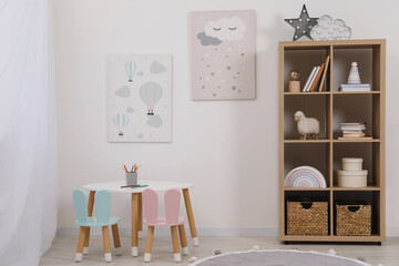 Child's room interior with modern furniture and beautiful pictures on wall