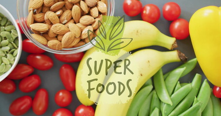 Super foods text image over healthy fruits, nuts, and vegetables