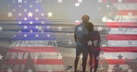 Image of american flag, stars and texture over diverse couple embracing on sunny beach