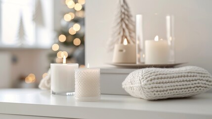 A table with candles and white blanket