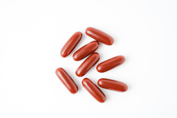 astaxanthin pills, Krill oil capsule, red brown supplement capsule isolated on white background