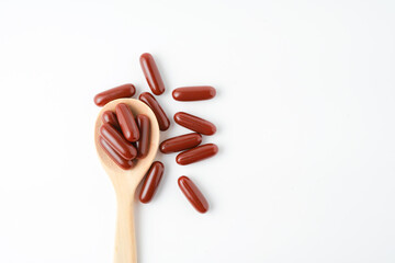 Brown softgel medical drug pill, supplement vitamin isolated over the white background
