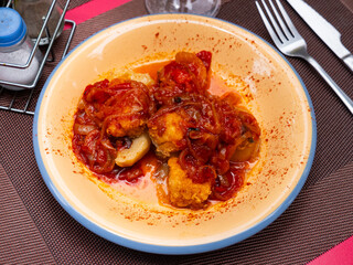 Hearty lunch, cooked xanfaina cod with seasonal vegetables on porcelain plate. Healthy food,...