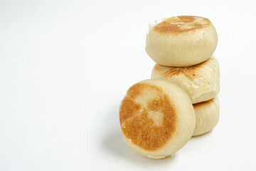 Bakpia is a food and souvenir typical of Yogyakarta made from a mixture of red beans or mung beans or cheese or yam coated with flour. That is an acculturation of Chinese culture. Isolated on white.
