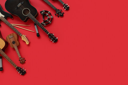 Different musical instruments on red background