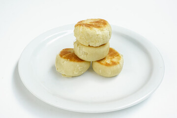 Bakpia is a food and souvenir typical of Yogyakarta made from a mixture of red beans or mung beans or cheese or yam coated with flour. That is an acculturation of Chinese culture. Isolated on white.