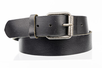 Black used thick real leather belt on a white background. Retro Vintage cow hide belt