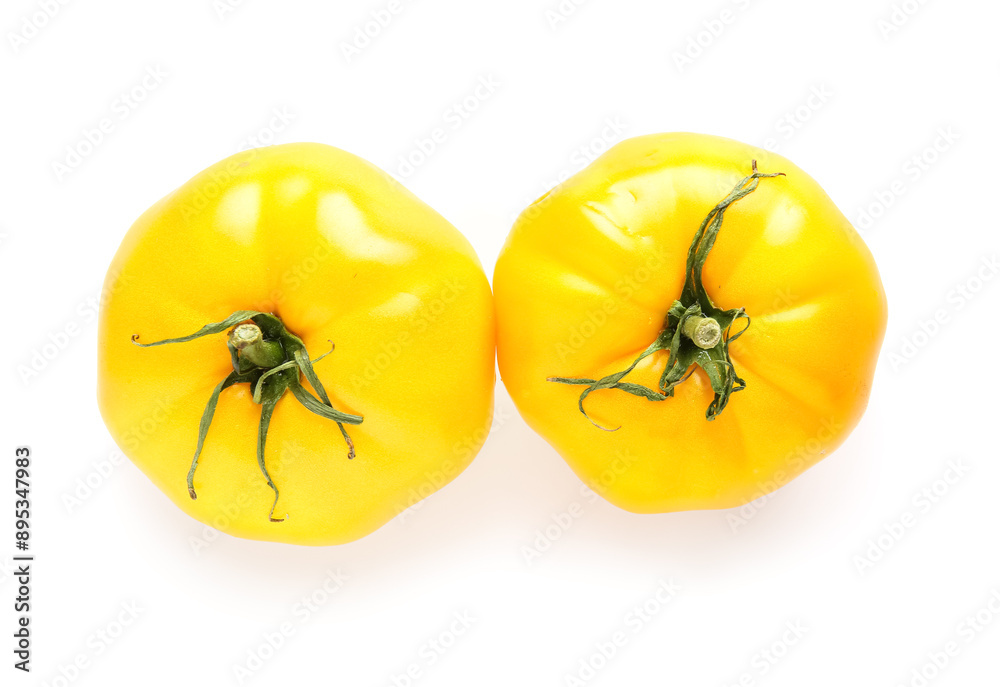 Wall mural Fresh yellow tomatoes on white background