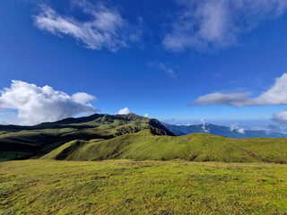 Beautiful mountain landscape in the Himalayas with a cloudy blue sky