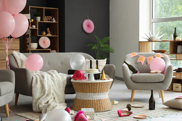 Interior of messy living room after Birthday celebration with sofa, armchair and table
