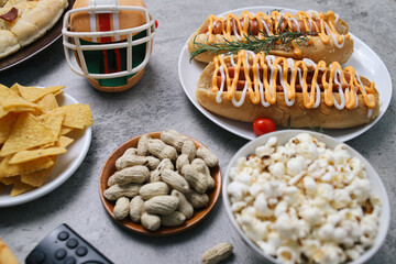 Various Fast Foods With Helmet And Remote Control On The Table