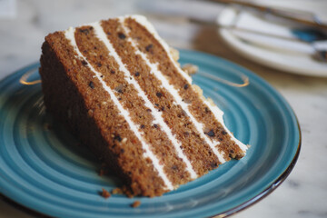 chocolate and cream cake on a plate on table 