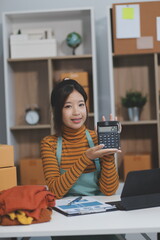 vlogger, blogger small SME business asian beautiful woman using mobile phone video call for sell...