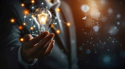 Businessman holding a light bulb with a glowing digital network and innovation concept on a dark background