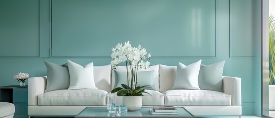 A living room with a blue wall and white furniture