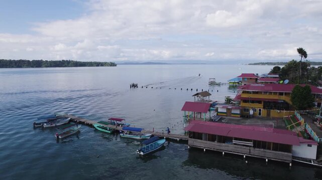 Colorful buildings and boats along the waterfront of Bastimentos Island, Bocas del Toro, Panama