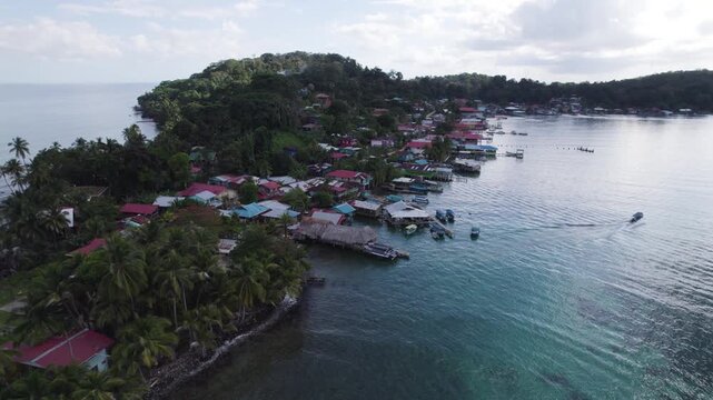 Bastimentos island with vibrant homes and lush greenery in bocas del toro, panama, aerial view
