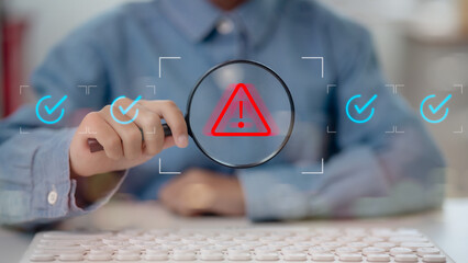 A man holding a magnifying glass is warning an alert of an error or security breach, something is wrong, and a compliance problem is detected.