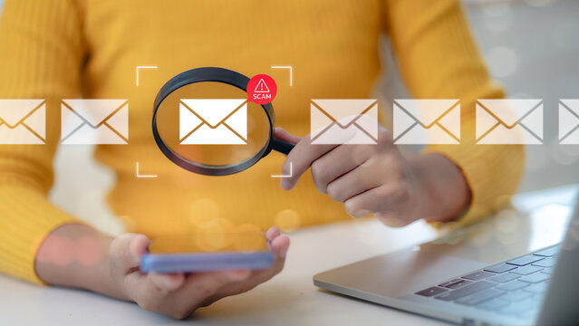 Women holding a magnifying glass are warning an alert of an email or security breach, something is wrong, and a compliance problem is detected. online communication and personalized advertisement via 