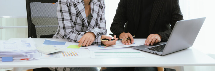 Close up of a team of business people having a meeting to analyze data for a marketing plan