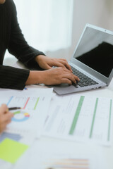 Close up of a team of business people having a meeting to analyze data for a marketing plan