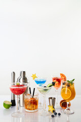 Summer cocktails in classic glasses on a white background. Party time