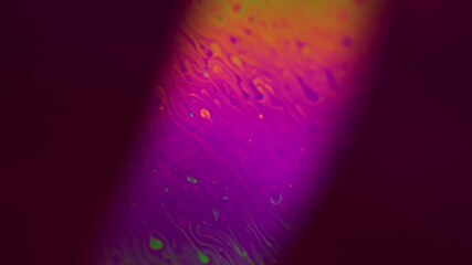 Lava lamp liquid. Lsd fluid drops. Luminescent paint. Defocused neon color green purple pink blue orange yellow color spill motion gradient in UV light ray abstract art background. - Powered by Adobe