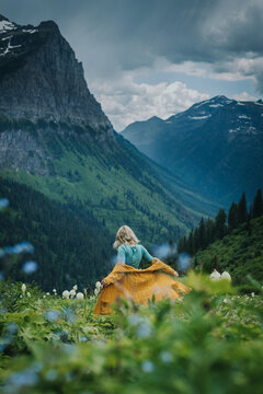 Girl Frolicking through the Flowers