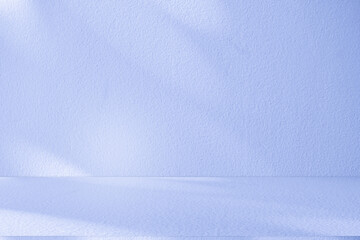 Studio style background wall decoration presentation uses white and blue tones. with shadows cast from a nearby window, concept creating a decorative backdrop.