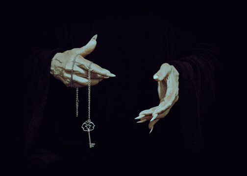 Pale witchy hands with sharp hold a chain with a magic key in the darkness, close-up, film grain.