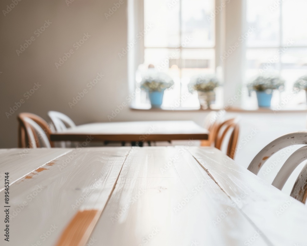 Poster sunlit minimalist white table for product display in modern stylish travel-themed cafe, soft natural