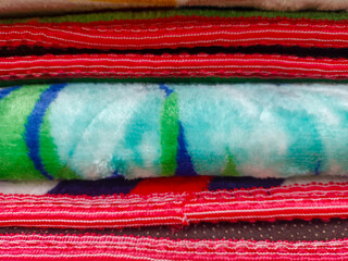 Obraz premium Close Up View Of The Texture Of A Folded Fluffy Carpet, With Colorful Patterns For The Background