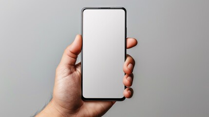 Detailed POV capture showing a hand holding a mobile phone with a blank white screen open to a messaging app interface Stock Photo with copy space