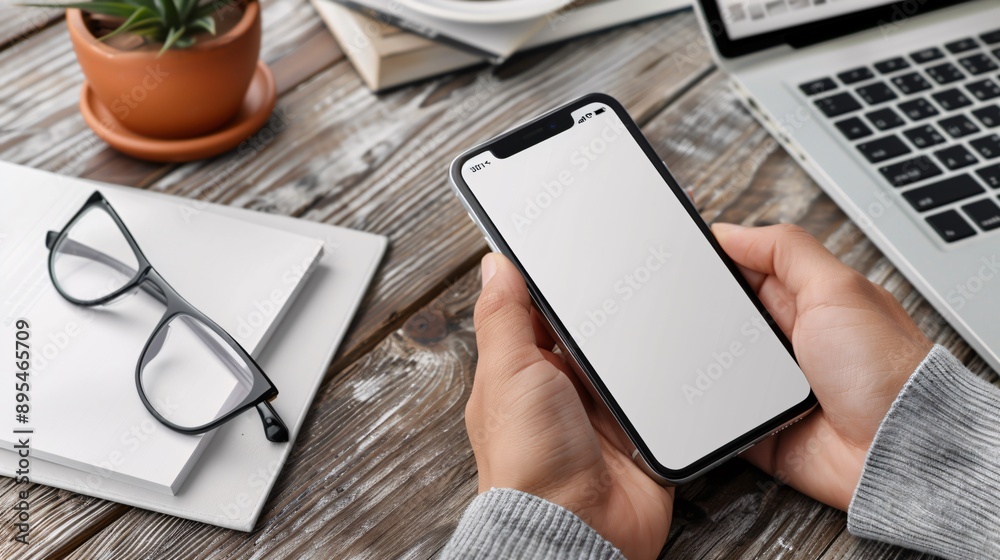 Aufkleber detailed pov capture of a hand holding a mobile phone with a blank white screen in a productivity to
