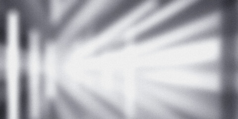 Grainy textured surface with light and shadow creating an abstract background