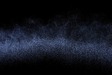 Abstract splashes of water on dark background. Black and blue grunge texture. Light clouds overlay texture on black backdrop.