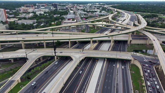 Interstate interchange in USA. I-4 in Orlando, Florida with multiple overpasses and traffic flow. Urban infrastructure and surrounding cityscape. Aerial.