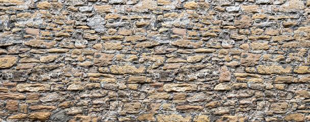 Obraz premium brown stone wall