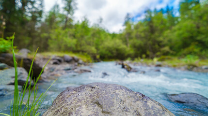 stone on the background of river