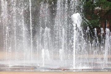 Splashes of water in a fountain in the park