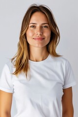 Fototapeta premium A woman in a white t - shirt is posing.