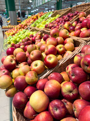 Red ripe apples on the Market showcase. Background