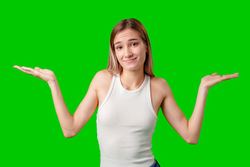 Young Woman Holding Out Both Hands In Front of Green Screen Background