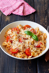 Farfalle pasta with tomatoes and cheese. Healthy eating. Vegetarian food.