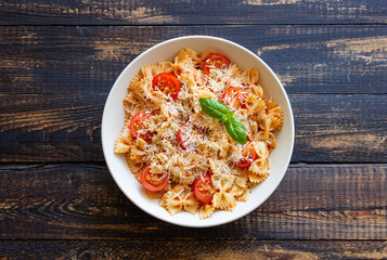 Farfalle pasta with tomatoes and cheese. Healthy eating. Vegetarian food.