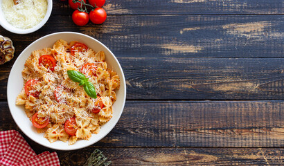 Farfalle pasta with tomatoes and cheese. Healthy eating. Vegetarian food.