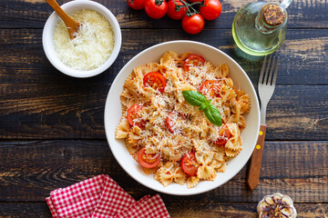 Farfalle pasta with tomatoes and cheese. Healthy eating. Vegetarian food.