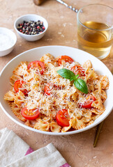 Farfalle pasta with tomatoes and cheese. Healthy eating. Vegetarian food.