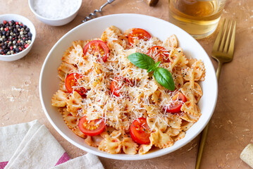 Farfalle pasta with tomatoes and cheese. Healthy eating. Vegetarian food.
